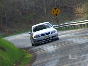 Car on winding wet road