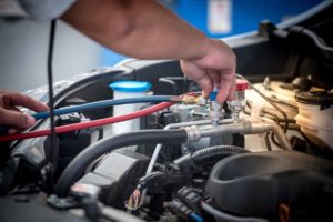 Servicing car air conditioner. Service station. Car repair. auto mechanic Check the pressure and leak. for use on air condition systems