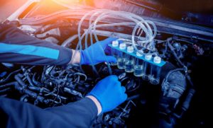 Cleaning engine injectors. Car repair. Service station.