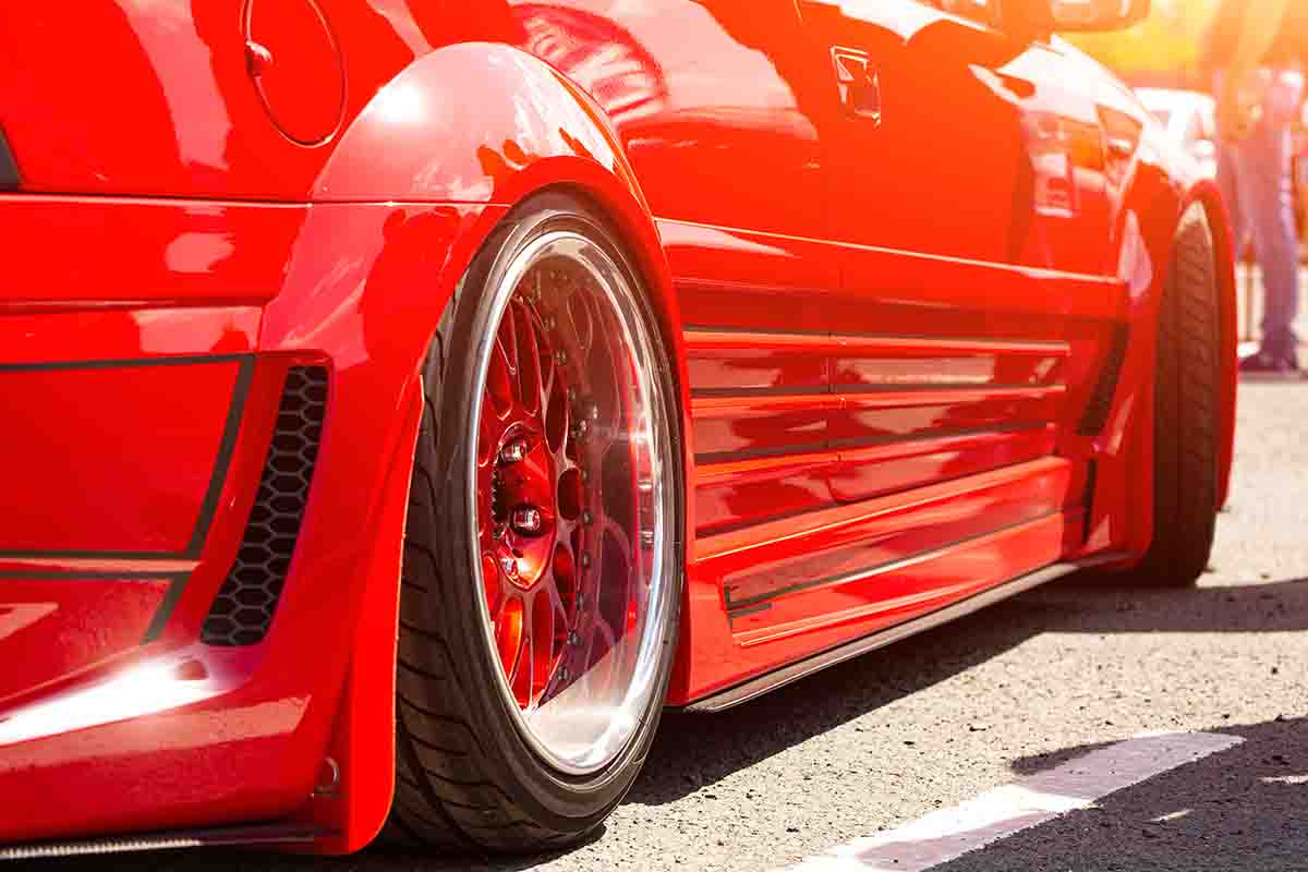 Exhaust & Suspension Repair in Brook Park, OH Rear view of the wheel of a red sports car