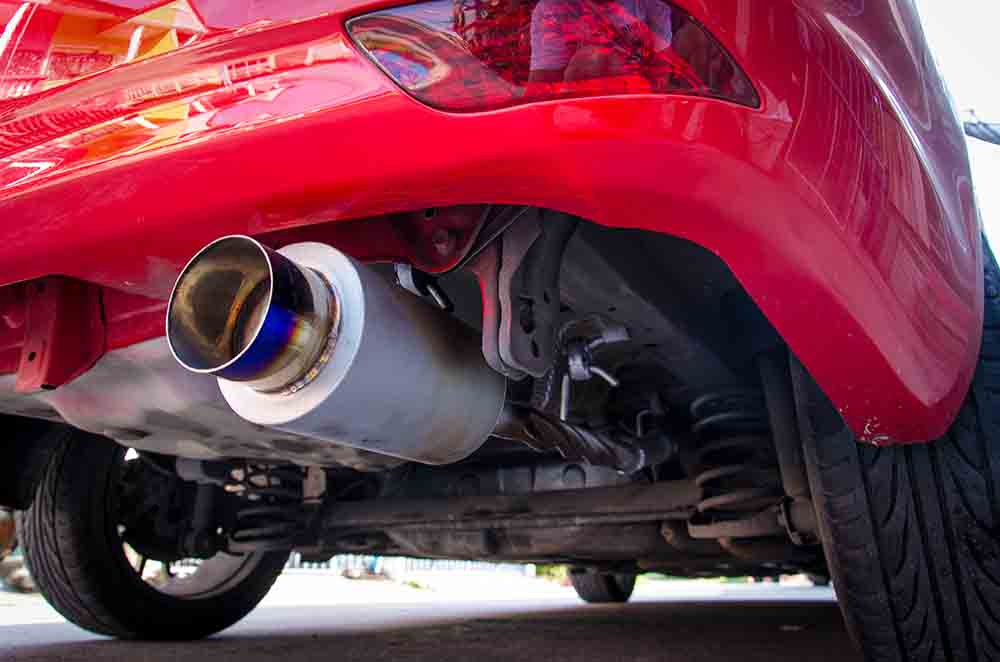 Exhaust & Suspension Repair in Brook Park, OH Exhaust pipe of red sports car