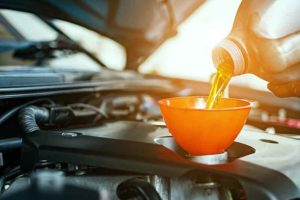 Hand mechanic in repairing car,Change the Oil